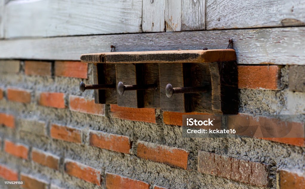 Brick Wall Racking Rack On The Weathered White Brick Wall Old Wall Hook Rack Stock Photo ...