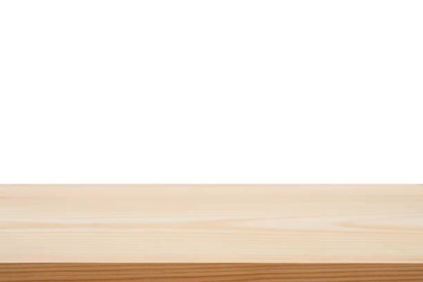istock Perspective empty brown wooden table with white background including clipping path for product display montage or design layout. 1174530228