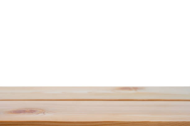 istock Perspective empty brown wooden table with white background including clipping path for product display montage or design layout. 1174530231