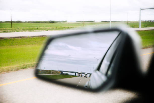 istock Semi trucks in the rearview mirror 1174530279