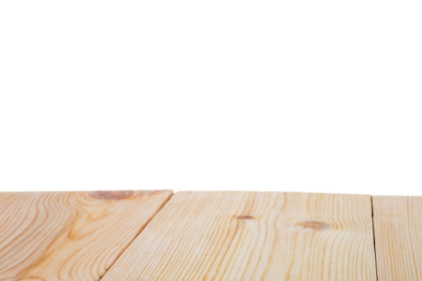 istock Perspective empty brown wooden table with white background including clipping path for product display montage or design layout. 1174530357