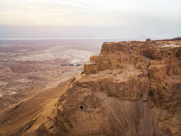 masada fortress area southern district of israel dead sea area southern district of israel. ancient jewish fortress of the roman empire on top of a rock in the judean desert, front view from the air - cloud mid air cloudscape aerial view imagens e fotografias de stock