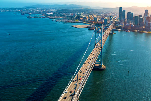 luftaufnahme der bay bridge in san francisco - blue bridge stock-fotos und bilder