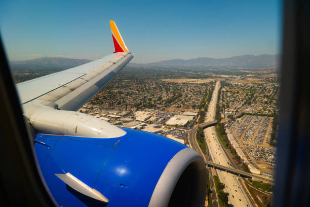 istock Airplane Passengers View Of The Jet Engine And Wing 1174549511