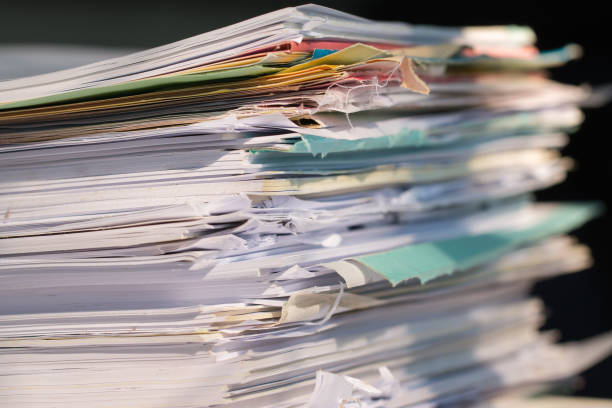 istock Piled heap high documents folders, Stack business paper on desk messy or paperwork in office. Old Document achieves in print folder doc forms, use recycling for save 1174552850