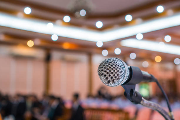 microphone abstract prepare for speaker speech of conference or seminar hall at exhibition room background. business talk presentation concept - blurred motion audio imagens e fotografias de stock