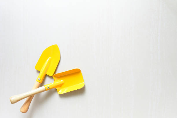 Yellow shovel trowel , garden tools, isolated on white background