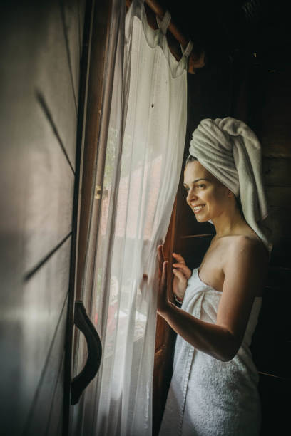 istock Young woman in bathrobe 1174559678