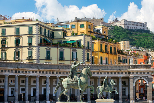 Naples, Italy - september 15, 2018: two equestrian monuments - Charles III (sculptor - Antonio Canova) and Ferdinand I (Antonio Cali) at the Plebiscito Square ( Piazza del Plebiscito ), citys main square, Naples, Italy