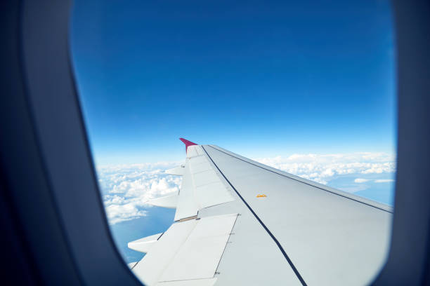 istock Airplane wing as seen from the passenger's seat. 1174563262
