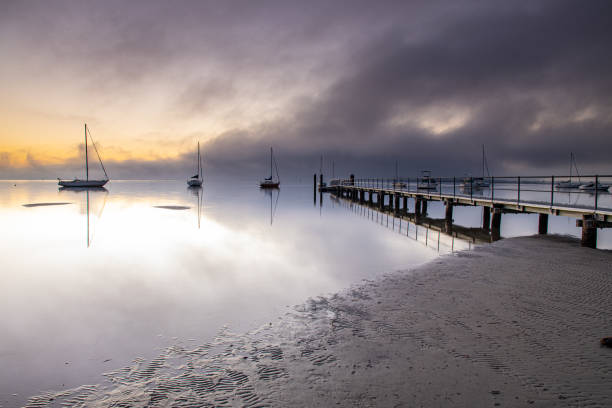 istock Misty Morning on the Bay with Boats 1174564122
