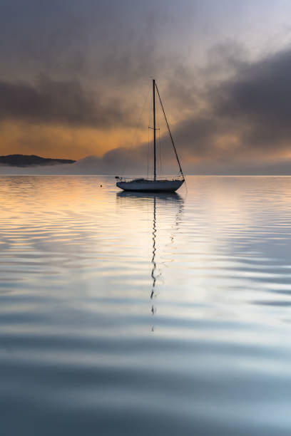 istock Misty Morning on the Bay with a Boat 1174564323