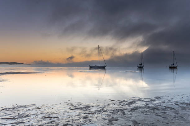istock Misty Morning on the Bay with Boats 1174565246