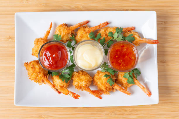 istock Batter-fried prawns in white plate with sauce 1174565755