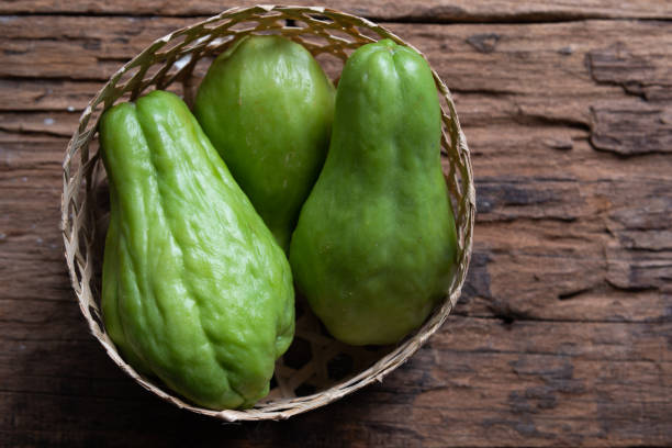 istock Fresh chayote fruits (Sechium edulis) on wood background 1174565803