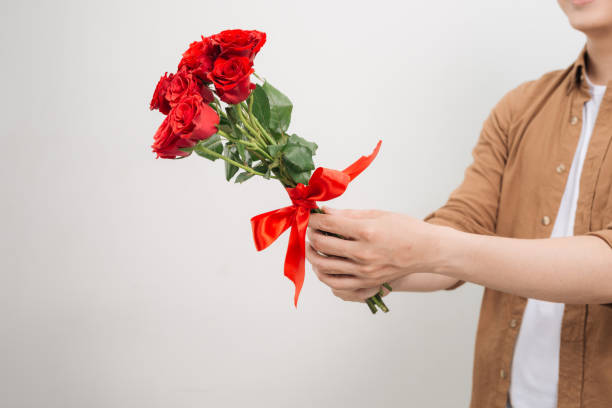 Free Stock Photo of Person Holding a Bunch of Red Roses | Download Free ...