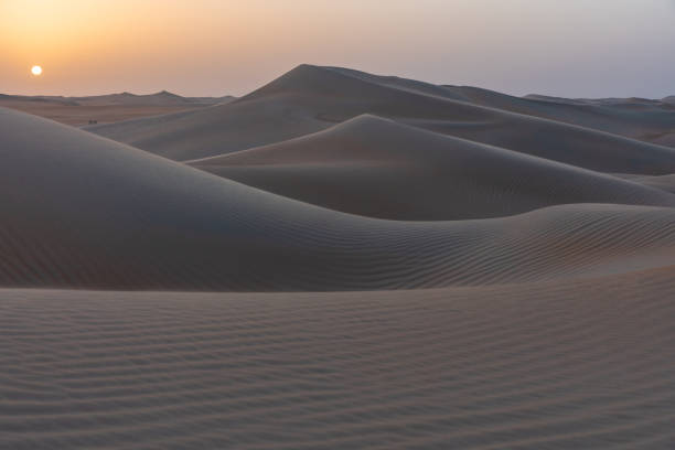 istock Sunrise in the arabic sand desert 1174566896