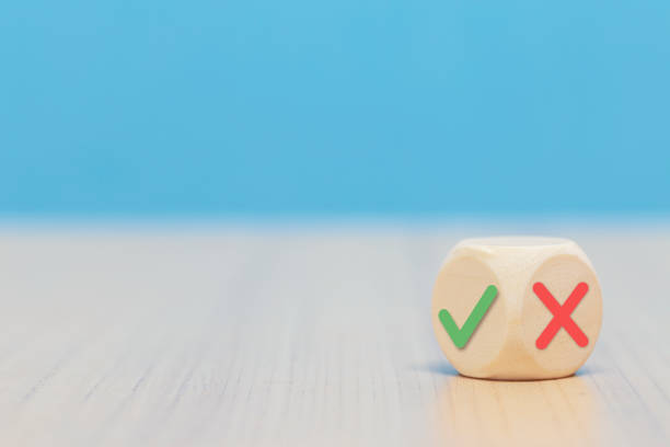 istock Yes or No symbols on wood blogs cube on blue background. 1174568777