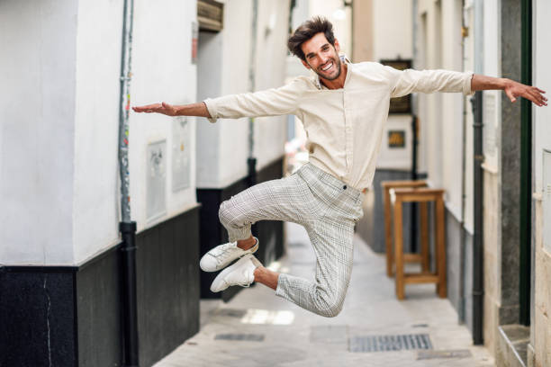 istock Young funny man jumping in the street. 1174570846