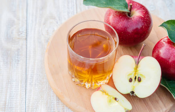 istock Apple juice in a glass. Selective focus. 1174572787
