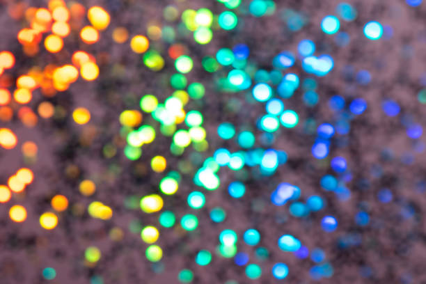 Colorful prism confetti blurred festive backdrop, trendy sparkles and glitter background, flat lay style. Christmas and holidays concept