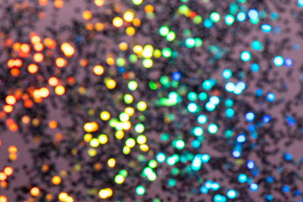 istock Colorful prism confetti blurred festive backdrop, trendy sparkles and glitter background, flat lay style. Christmas and holidays concept 1174573754