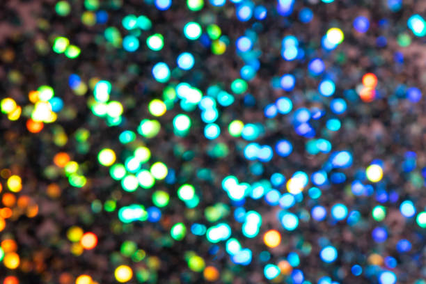 istock Colorful prism confetti blurred festive backdrop, trendy sparkles and glitter background, flat lay style. Christmas and holidays concept 1174573792
