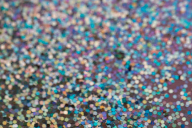 istock Colorful prism confetti blurred festive backdrop, trendy sparkles and glitter background, flat lay style. Christmas and holidays concept 1174573834