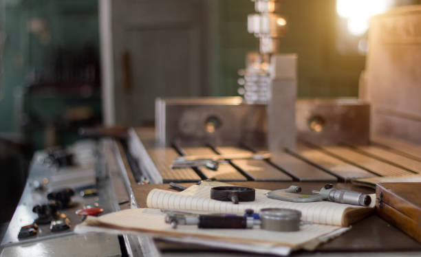 istock A private workshop for working with metal parts, in the background a drilling machine drills a hole in the pulley, on the table lie measuring instruments 1174578581