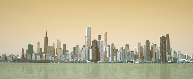 Chicago city skyline with buildings reflection on the water