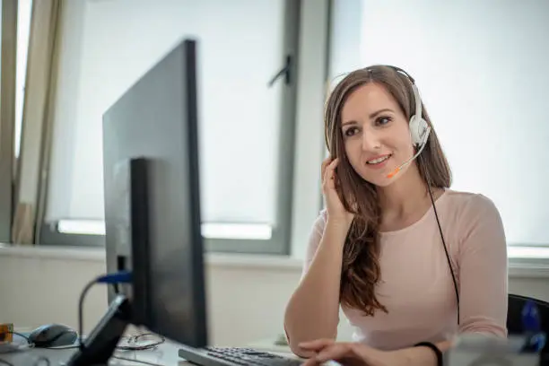 Photo of Female operator working in the office