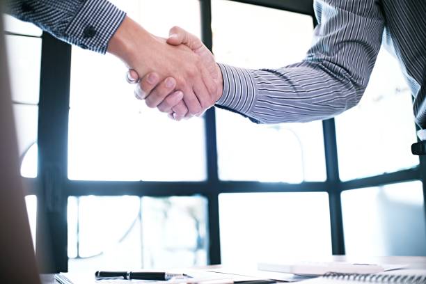 istock Image business mans handshake. Business partnership meeting concept. 1174591874