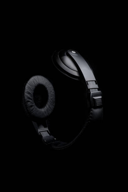istock large headphones on a black background 1174596773