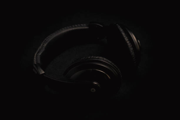 istock large headphones on a black background 1174596790