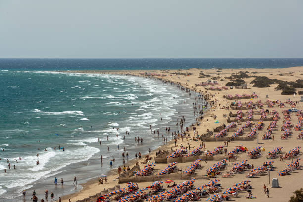 istock Mass tourism at beach in Playa del Ingles 1174597589