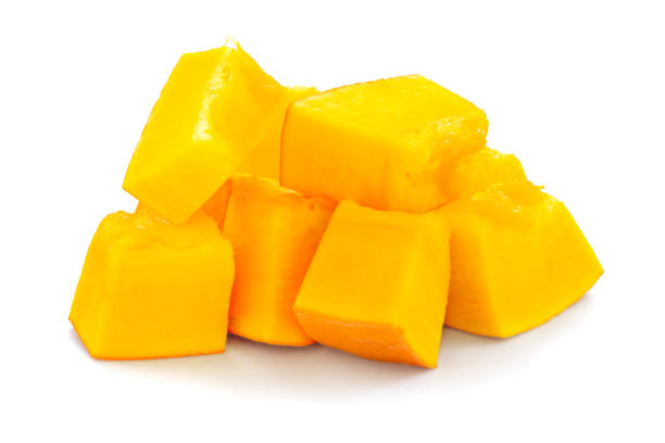 istock Sliced pumpkin isolated on a white background with shadow. Sliced pumpkin isolated on white. Pieces of pumpkin, side view. Diced orange pumpkin, closeup. 1174600678