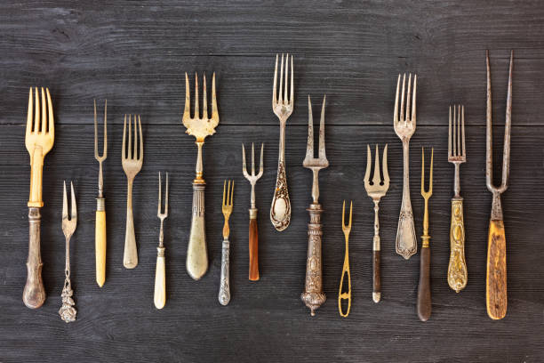 istock Top view on various forks, old utensils. Flat lay on rustic wooden background. Antique kitchenware background 1174604311