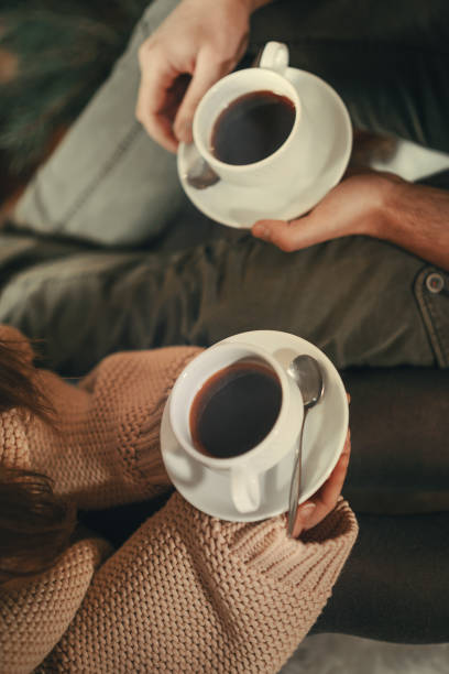 istock Loving couple by fireplace on Christmas 1174605736