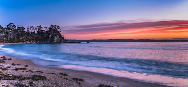 istock Colourful Streaky Clouds Sunrise Seascape 1174605850