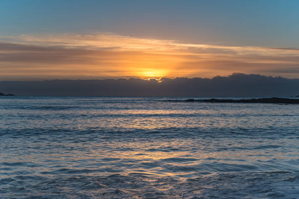 istock Colourful Streaky Clouds Sunrise Seascape 1174605890