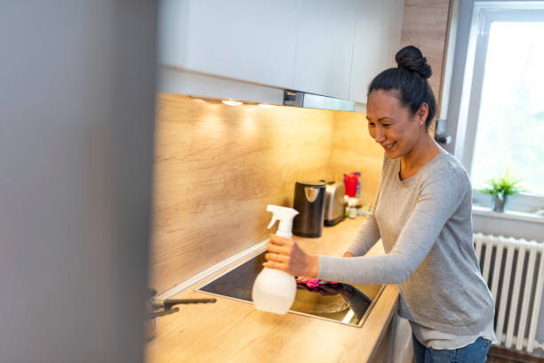 istock Woman washing kitchen hood 1174607736