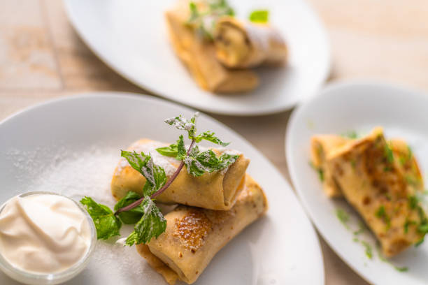 istock Sweet Stuffed Pancakes with a Sour Cream 1174608380