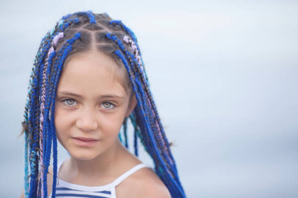 portrait of a girl with dreadlocks on a light background - facial expression isolated lifestyles exoticism imagens e fotografias de stock