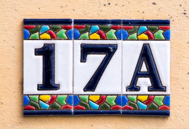 istock Decorative ceramic house number 17A tile on the wall, characteristic decorative element 1174610579