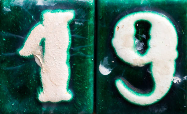 istock Decorative ceramic house number 19 tile on the wall, characteristic decorative element 1174610587