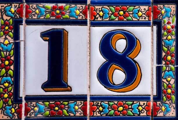 istock Decorative ceramic house number 18 tile on the wall, characteristic decorative element 1174610601