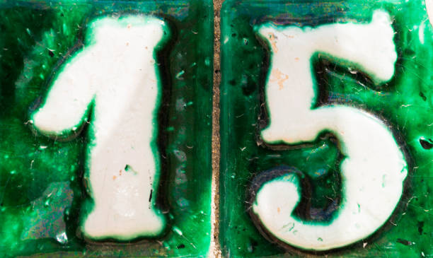 istock Decorative ceramic house number 15 tile on the wall, characteristic decorative element 1174610606