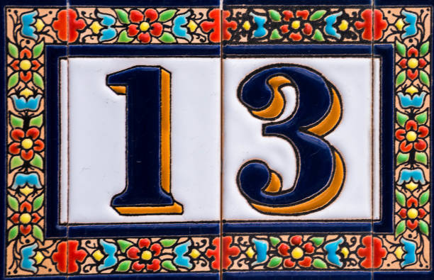 istock Decorative ceramic house number  13 tile on the wall, characteristic decorative element 1174610618