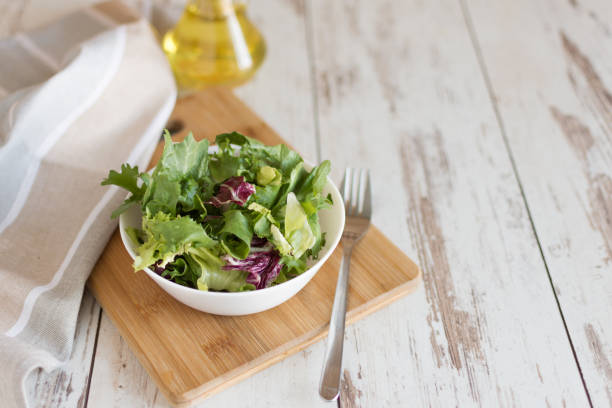 Fresh green salad with spinach,arugula,romaine and lettuce.
