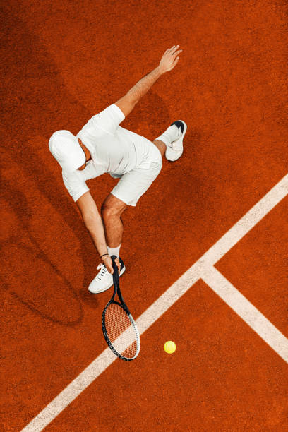 istock Handsome man on tennis court 1174616505
